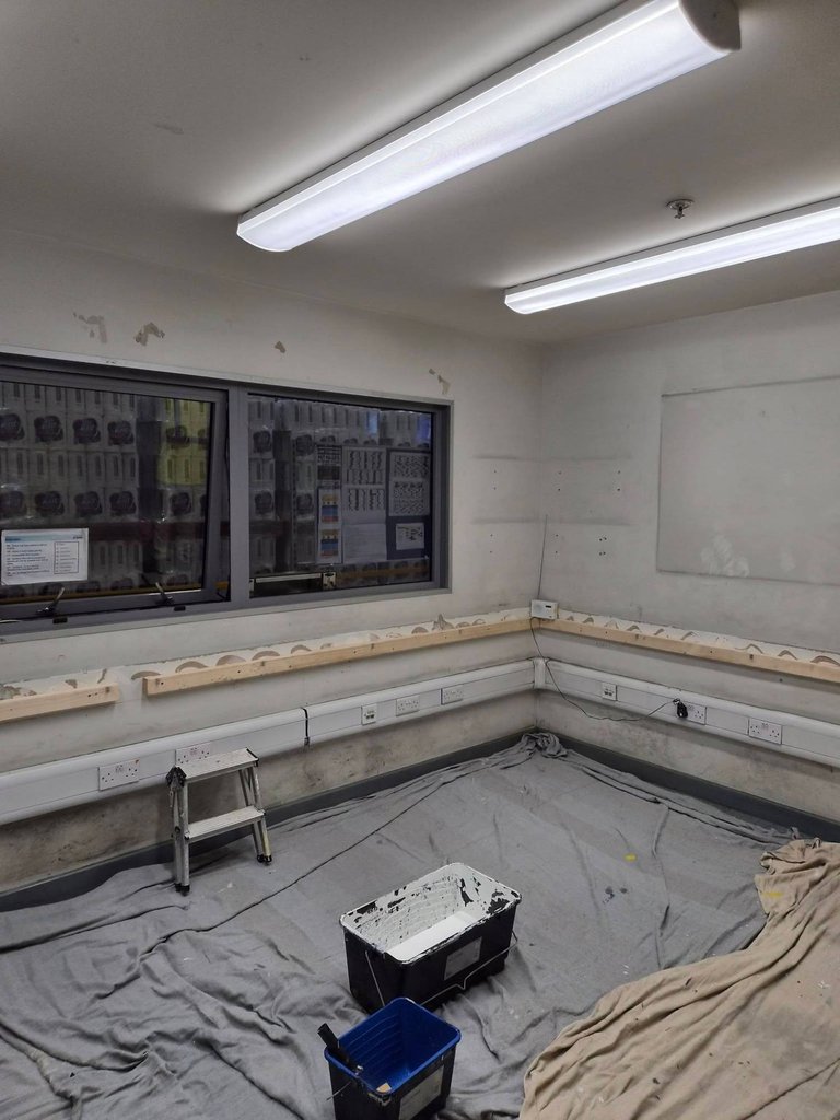 Office at Aldi Darlington Distribution Centre with dust sheets down and walls filled during preparation for redecoration