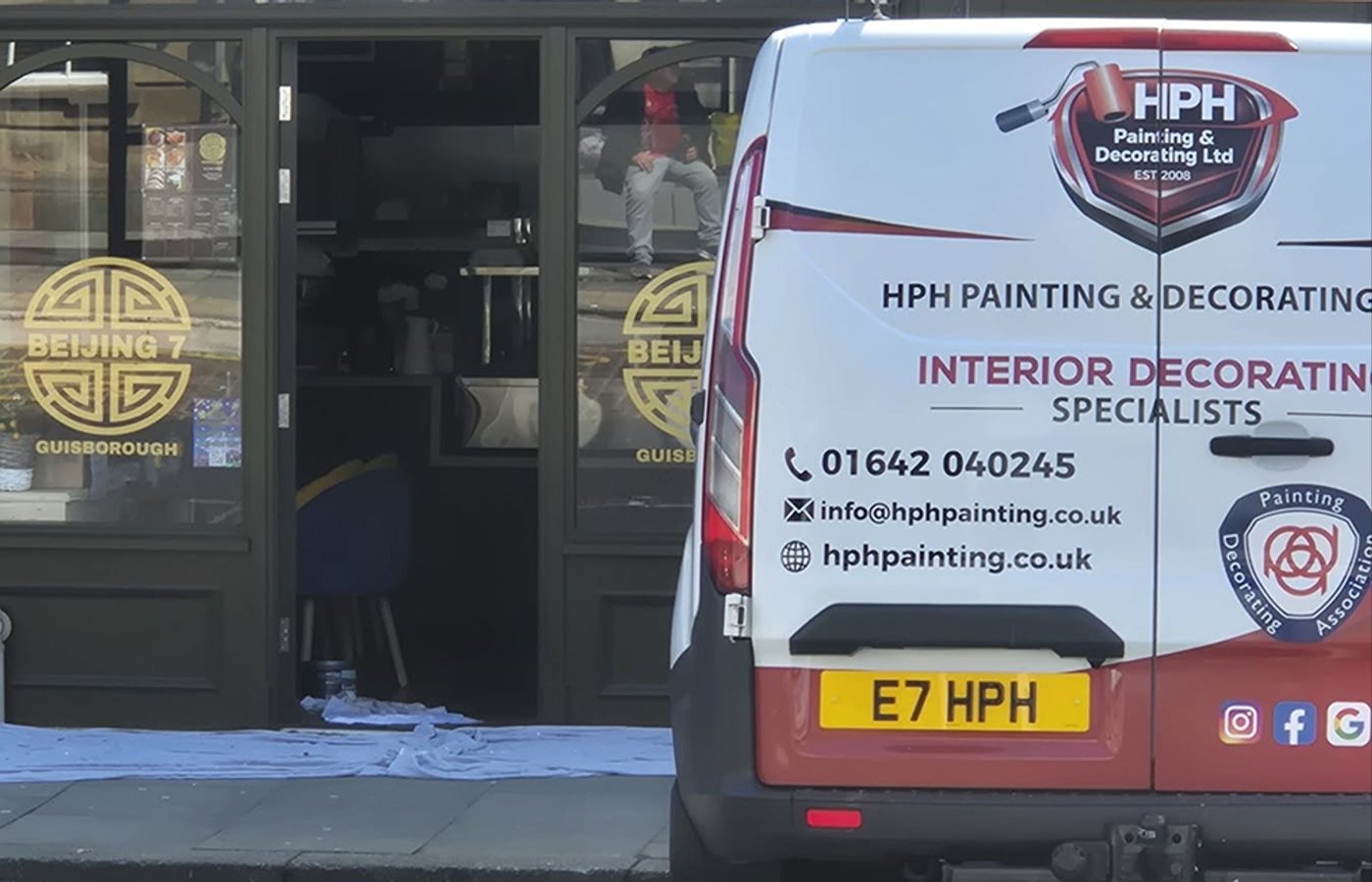 HPH Painting and Decorating van outside a completed commercial project