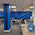 Finished Bertling office with blue branded feature walls, striped columns and diagonal detailing