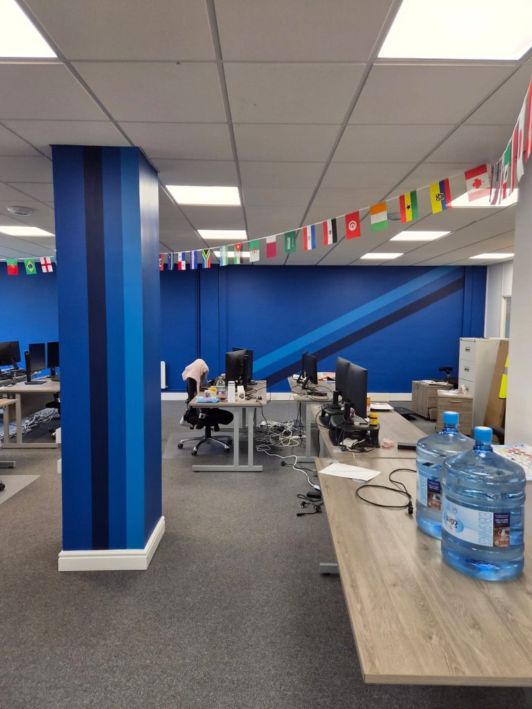 Completed Bertling office by HPH Painting and Decorating with blue feature walls and striped columns