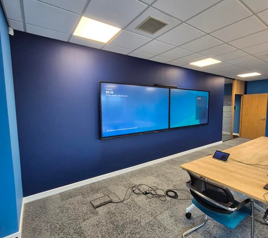 Commercial meeting room with a newly painted navy feature wall