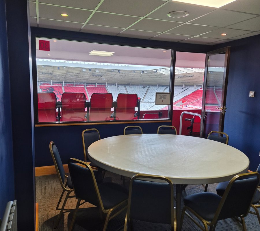 Navy painted stadium hospitality suite overlooking the stands