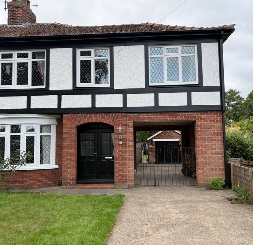 Black and white exterior painting completed by HPH Painting & Decorating