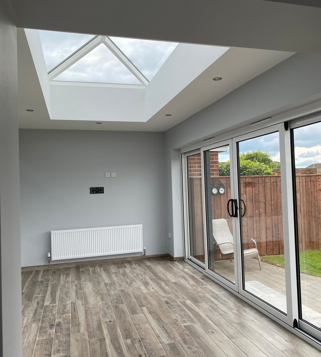 Freshly painted extension with a roof lantern and crisp white finishes