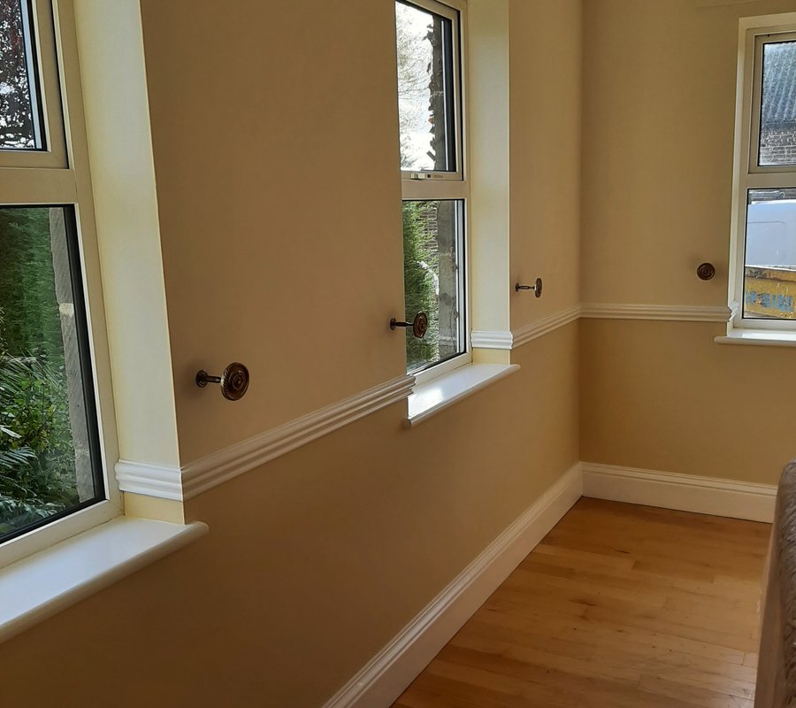 Decorated traditional interior with detailed white mouldings