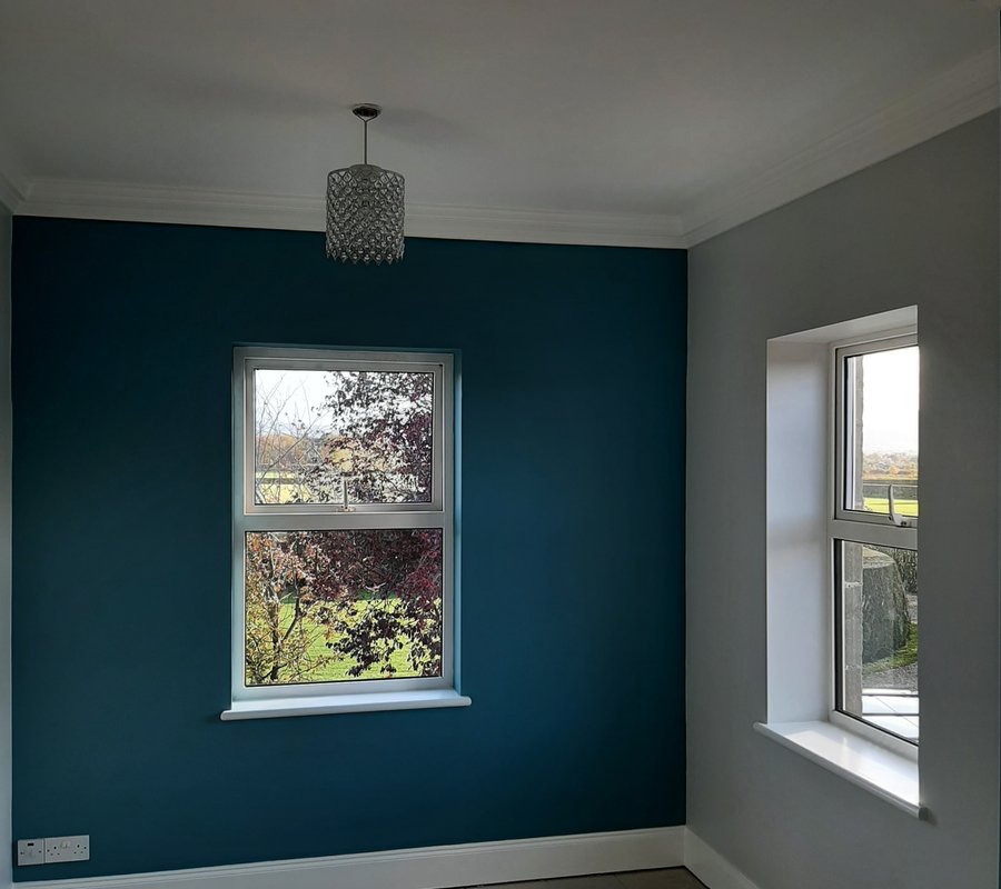 Teal feature wall with crisp white trim