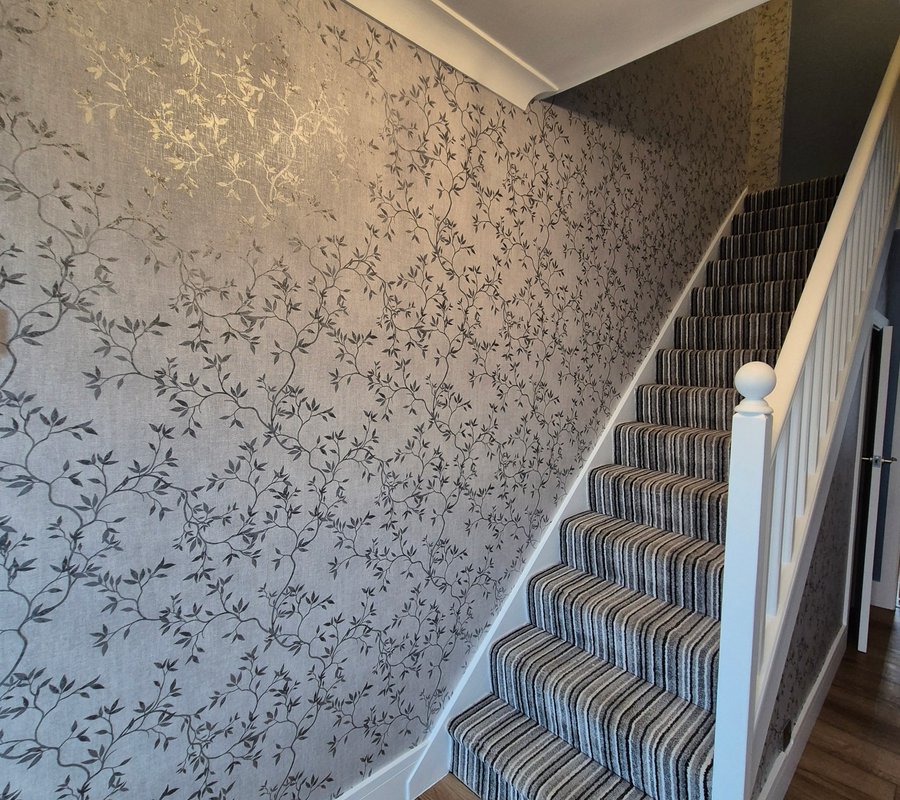Botanical wallpapered hallway and staircase
