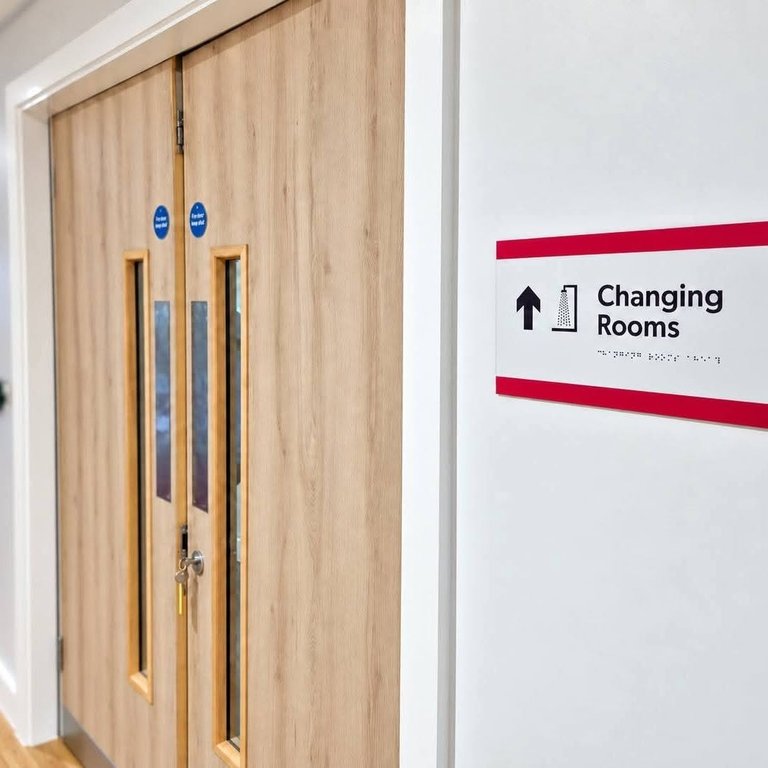White painted corridor and door frames outside the changing rooms at Middlesbrough FC Foundation East Cleveland